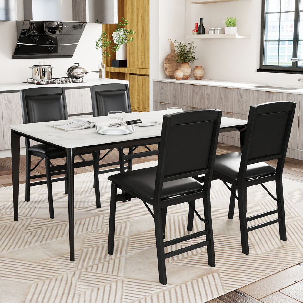 Set of 4 black folding dining chairs with padded seats and high backrests, perfect for stylish and comfortable dining.