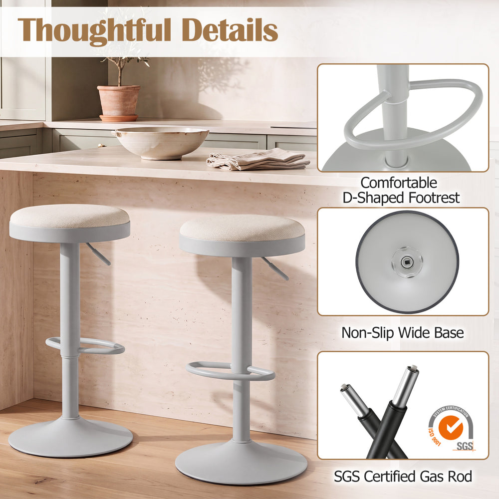 Set of 4 gray kitchen bar stools with height adjustment, padded seat, and D-shaped footrest for versatile comfort.