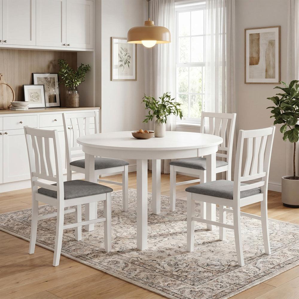 Set of 4 white upholstered kitchen chairs with slatted backrests, perfect for modern farmhouse dining spaces.