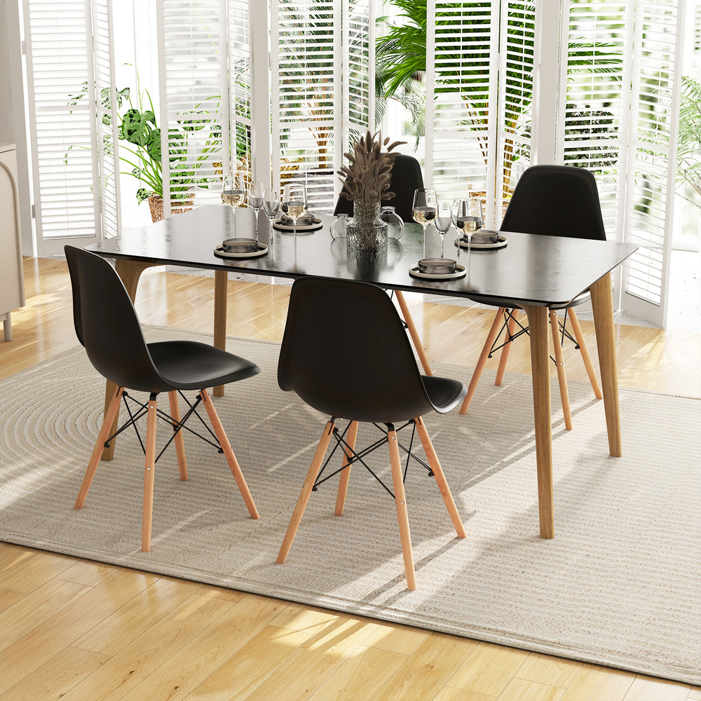 Modern black dining chair set with wood legs, ergonomic design for comfort, ideal for kitchen or dining room use.