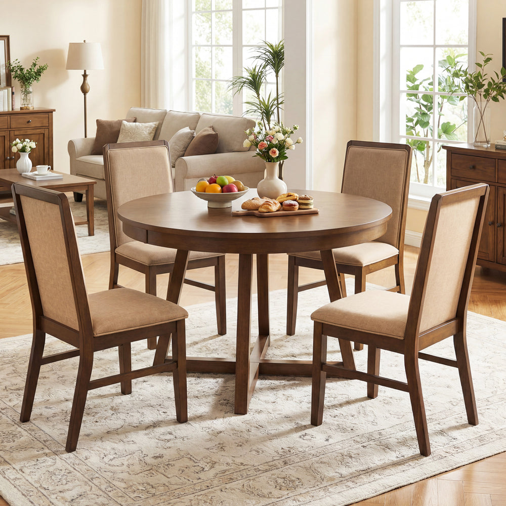 Round dining table set with four upholstered chairs in brown, featuring solid rubber wood legs and a rustic design for.