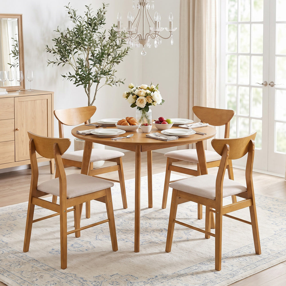 Set of 4 upholstered dining chairs with curved backrest and rubber wood frame, ideal for dining and kitchen spaces.