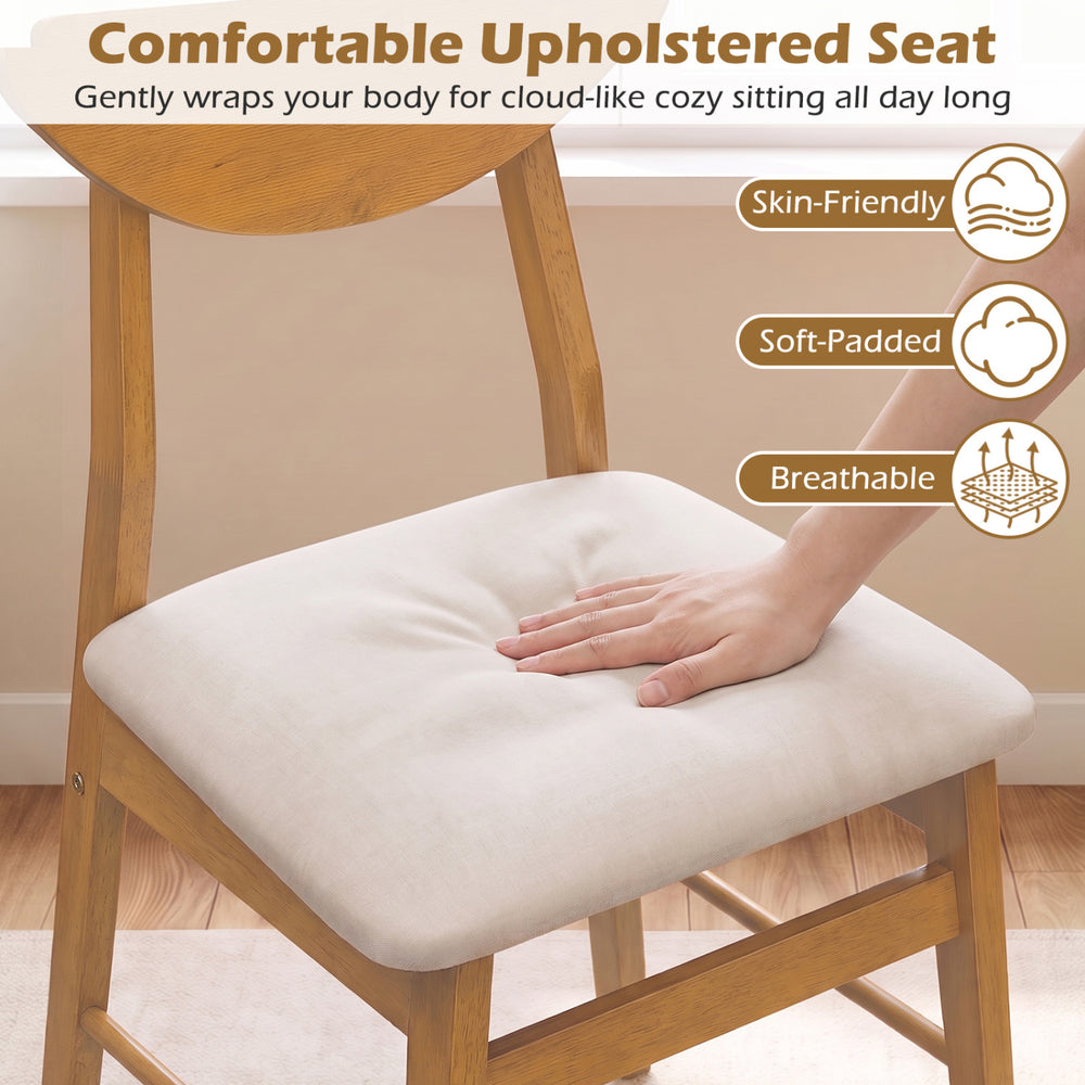 Upholstered dining chair with a curved backrest, soft-padded cushion, and rubber wood frame for stable seating.