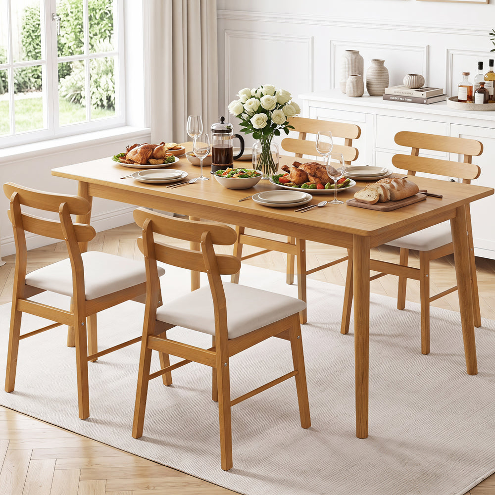 Set of 4 upholstered dining chairs with padded seats and solid rubber wood legs, perfect for comfortable dining experiences.