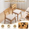 Set of 4 upholstered dining chairs with padded seats and solid rubber wood legs for stable and elegant dining experiences.