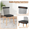 Windsor dining chair with spindle backrest, black finish, and curved seat for comfort, ideal for dining rooms and.