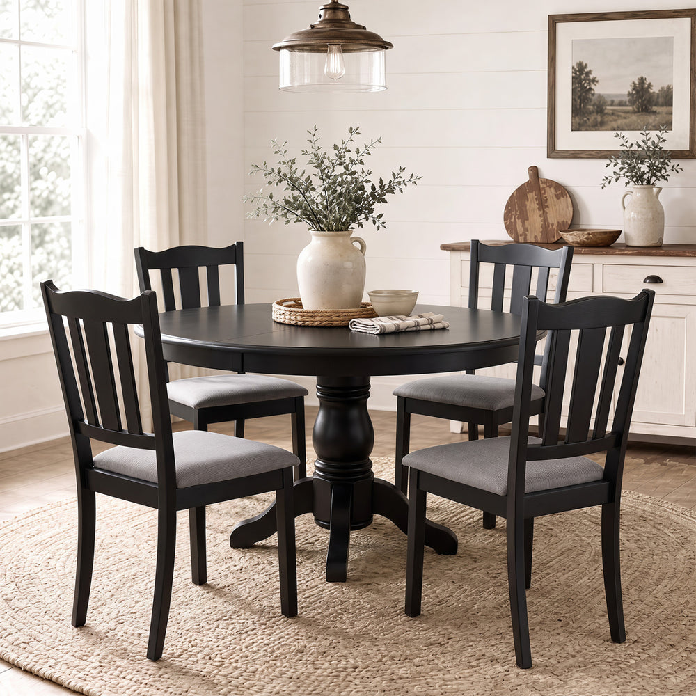 Set of 4 black wooden dining chairs with hollow back and soft-padded cushions for comfortable farmhouse-style seating.