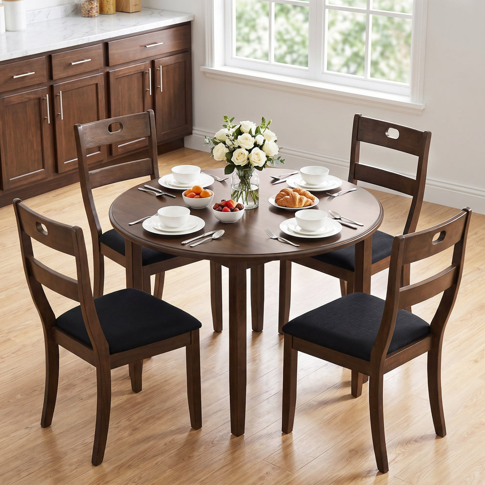 Round dining table set featuring four walnut wooden chairs with padded seats, perfect for dining rooms and kitchens.