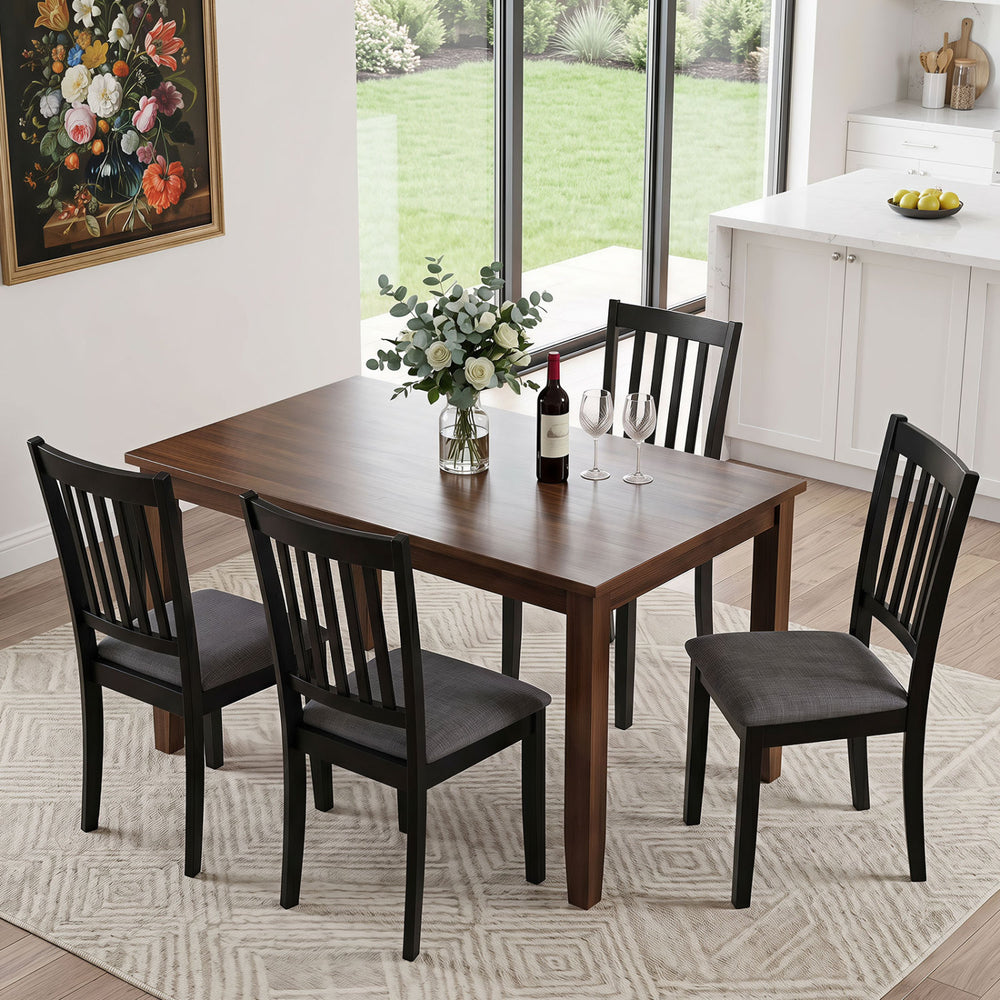 Set of four black wooden upholstered dining chairs with thick padded seats, perfect for dining rooms and kitchens.