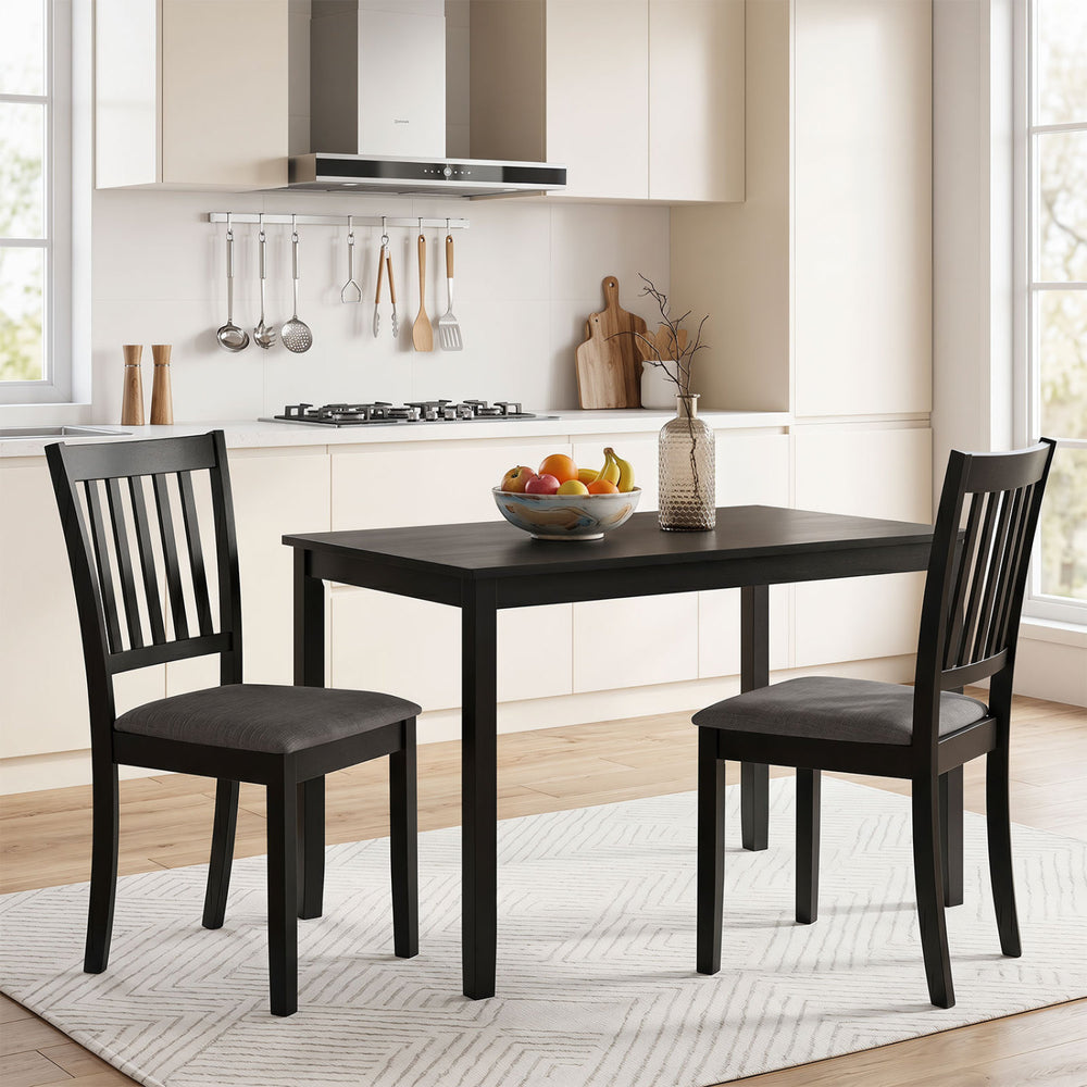 Black wooden dining chairs with thick padded seats and breathable fabric, perfect for dining rooms and kitchens.