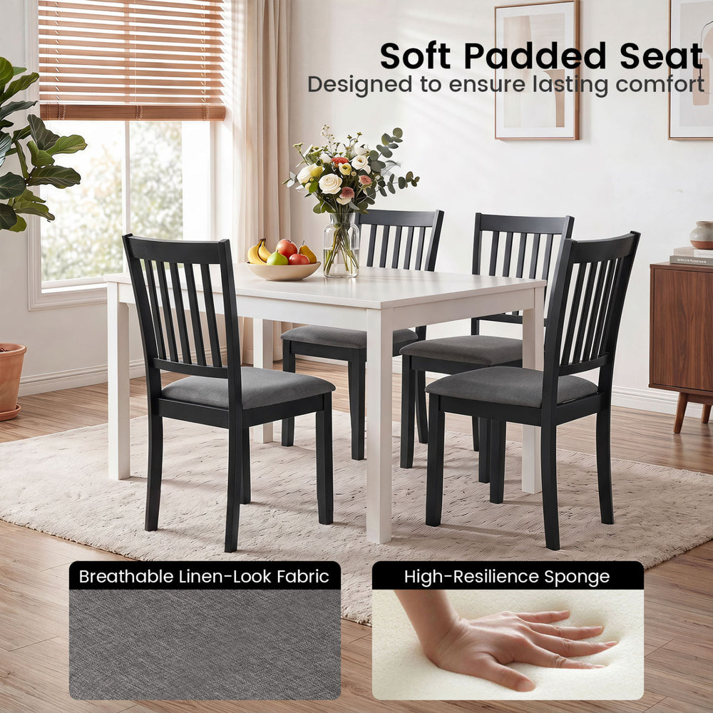 Set of 4 black wooden dining chairs with thick padded seats and breathable linen-look fabric for lasting comfort.