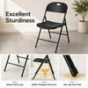 Foldable black plastic chair with ergonomic backrest, robust metal legs, and non-slip foot pads for versatile use.