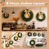 Set of 6 unlit artificial Christmas wreaths in vibrant green, perfect for decorating cafes, kitchens, and staircases.