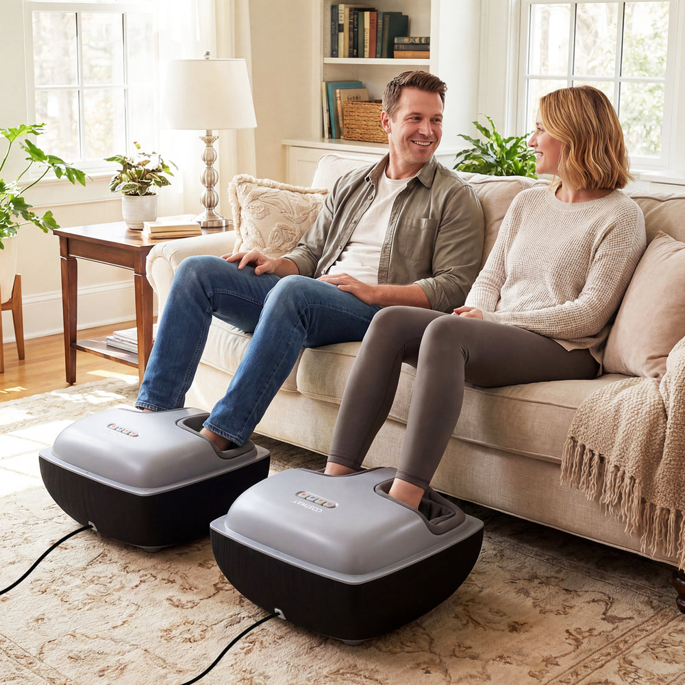 Shiatsu foot massager in black with air compression and heat, providing deep kneading for relaxation on a sofa.