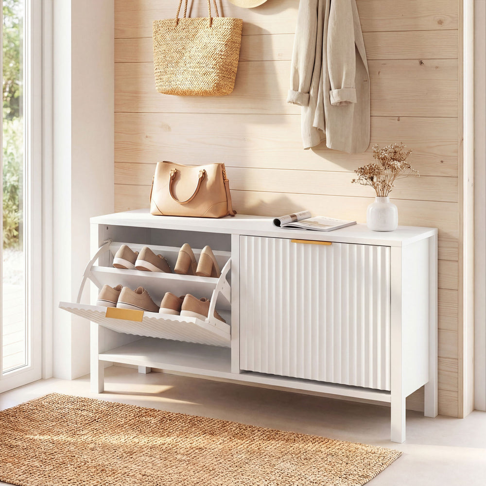 Narrow white shoe storage bench with 2 flip drawers and elegant fluted doors, perfect for entryways or hallways.