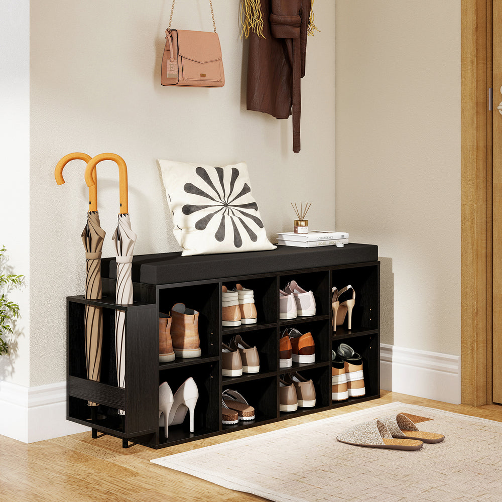 Shoe storage bench with 10 cubbies and umbrella stand in black, featuring a soft padded seat for entryway organization.