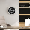 Silent wall clock with silver frame and decorative numbers, perfect for elegant room decor and easy time setting.