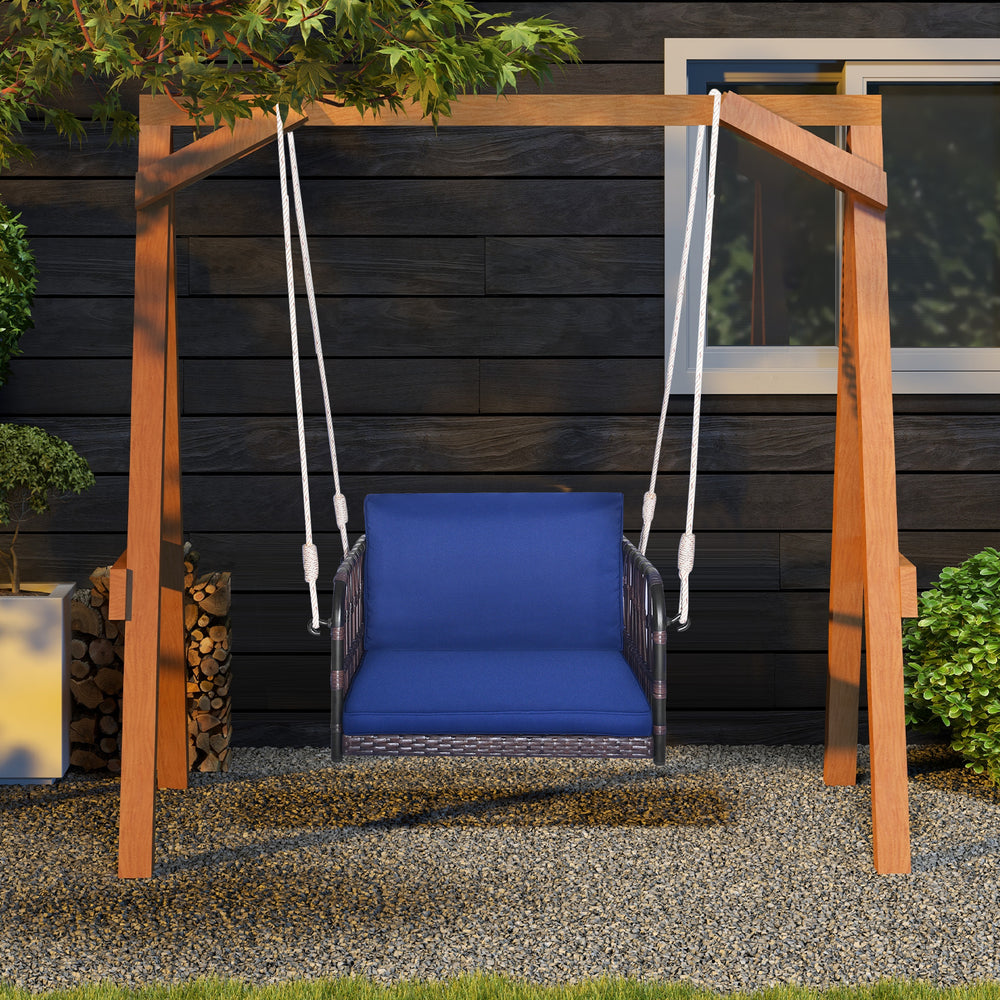Single person hanging seat with navy cushions, durable PE rattan, perfect for backyard relaxation.
