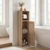 Freestanding slim bathroom cabinet in natural wood with door, toilet paper holder, and open cubby for storage.