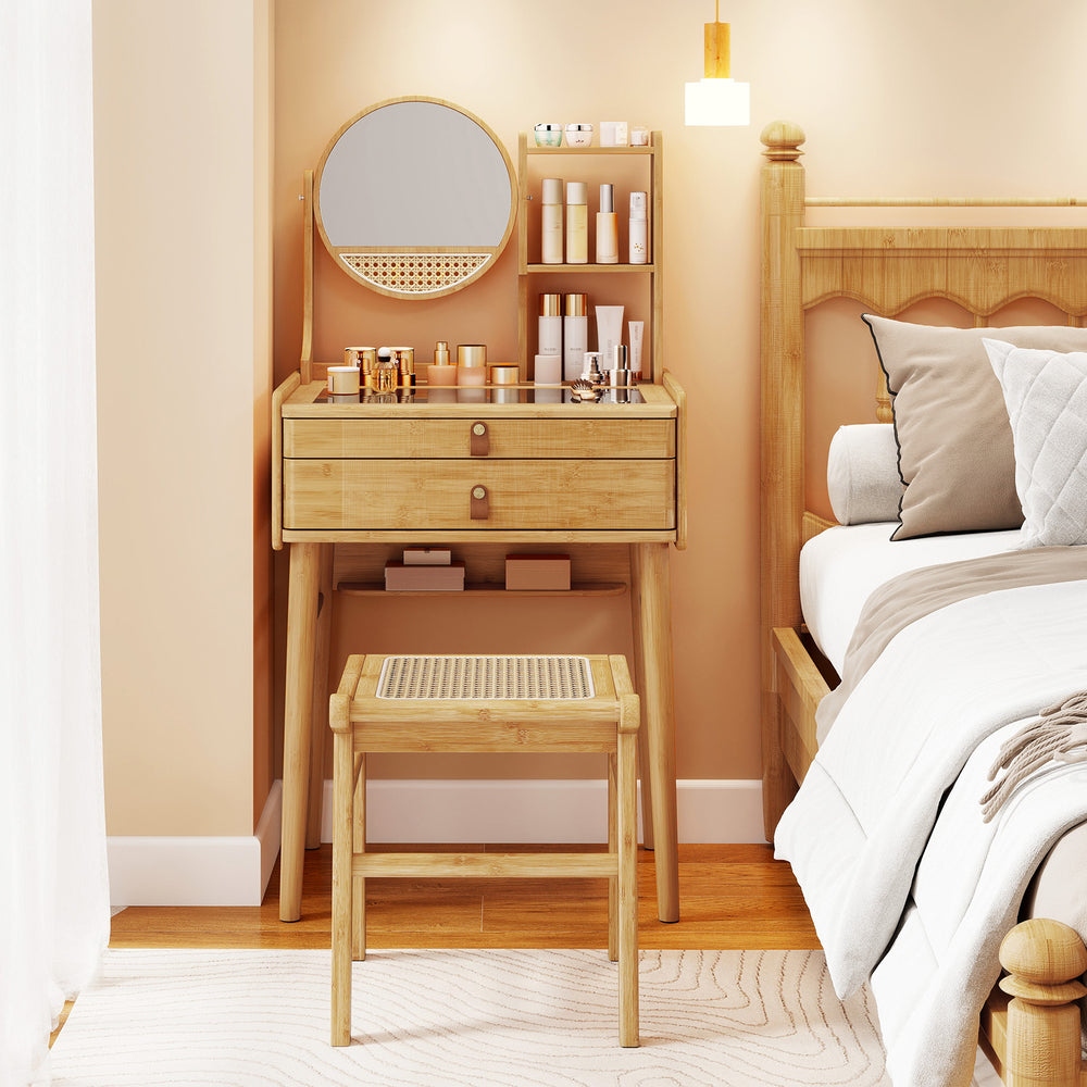 Small bamboo vanity desk with mirror, 2 drawers, and stool, ideal for compact bedrooms and stylish storage solutions.