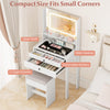 Small vanity desk with mirror and lights, featuring a sleek glass top, open shelf, and two large drawers for organized.