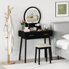 Small black vanity makeup dressing table set with LED lighted mirror and cushioned stool, perfect for compact bedrooms.