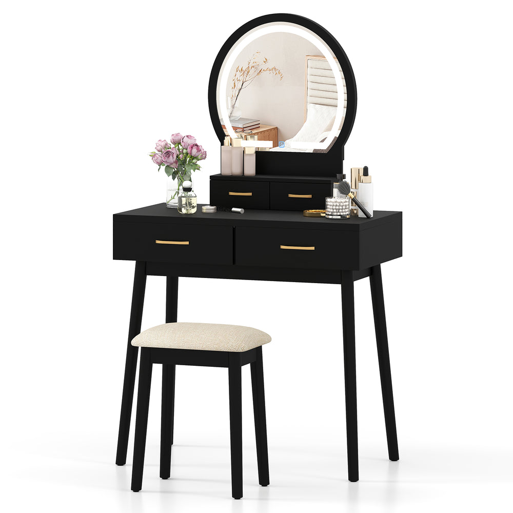 Black small vanity makeup dressing table set with cushioned stool and LED lighted mirror for compact bedroom spaces.