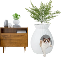 Smart Plant Cat Litter Box in white with electronic odor removal, featuring a cat inside and decorative plant on top.