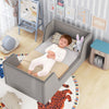 Gray soft velvet toddler bed frame with safety rails, featuring a child sleeping comfortably, ideal for safe and cozy.