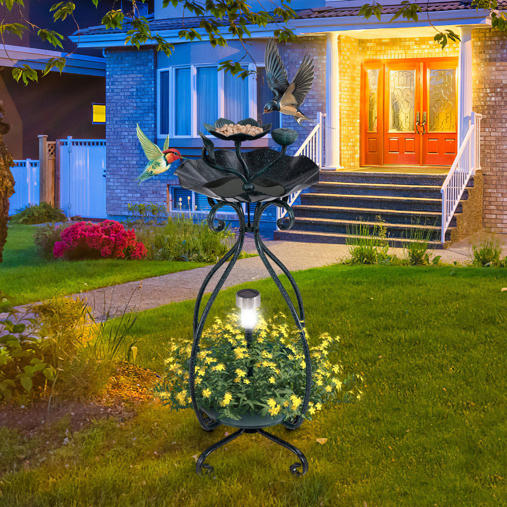 Solar outdoor bird bath feeder combo with flower planter, bronze finish, featuring birds and solar lights for garden.