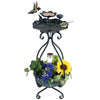 Solar outdoor bird bath feeder combo with flower planter, featuring lotus design and solar lights for garden decor.