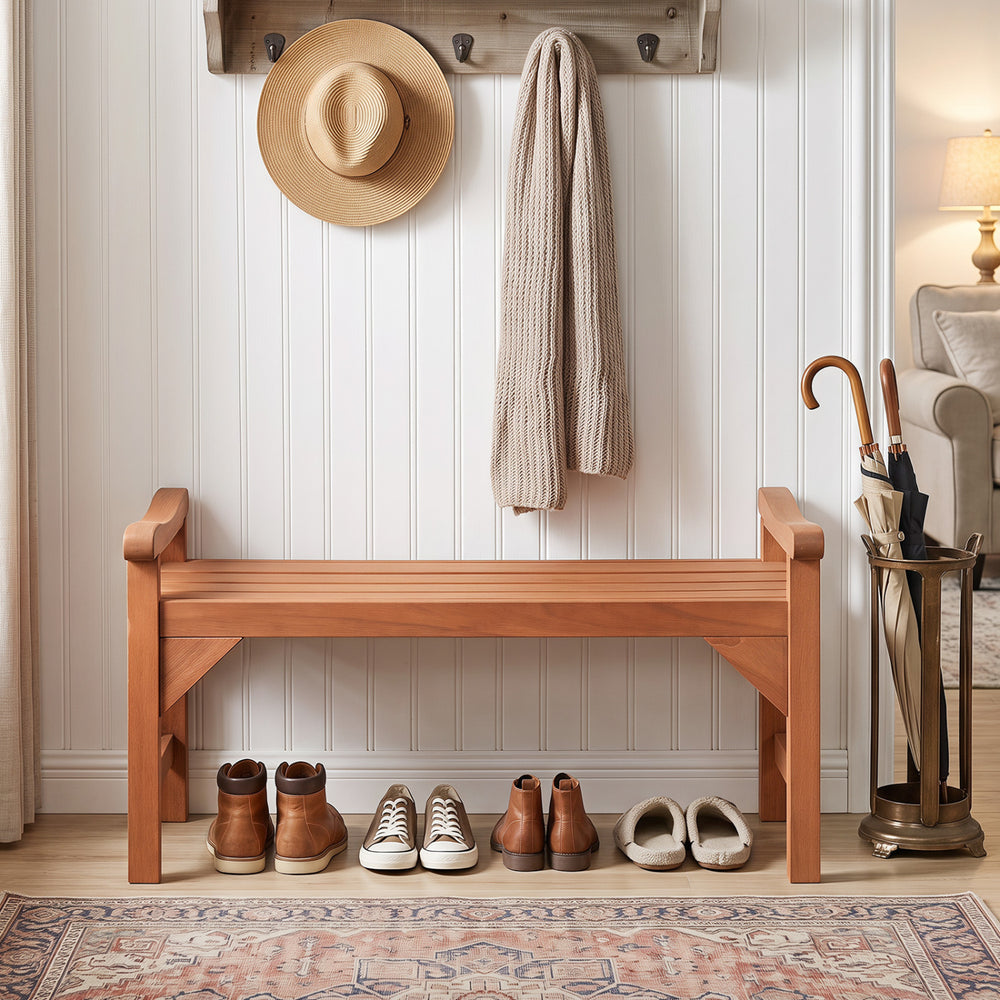 Solid wood backless garden bench with support handles and curved slatted seat, ideal for porch or deck seating.
