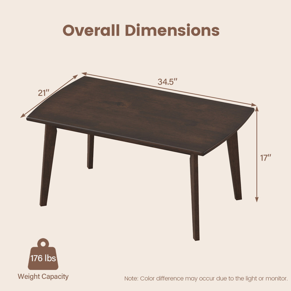 Solid wood modern coffee table with tapered legs, walnut finish, dimensions 34.5" x 21" x 17", ideal for living room.