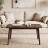 Solid wood modern coffee table with tapered legs in walnut finish, ideal for living room or office use.