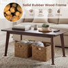 Solid wood coffee table with tapered legs in walnut finish, featuring a wide tabletop and unique wood grain for modern.