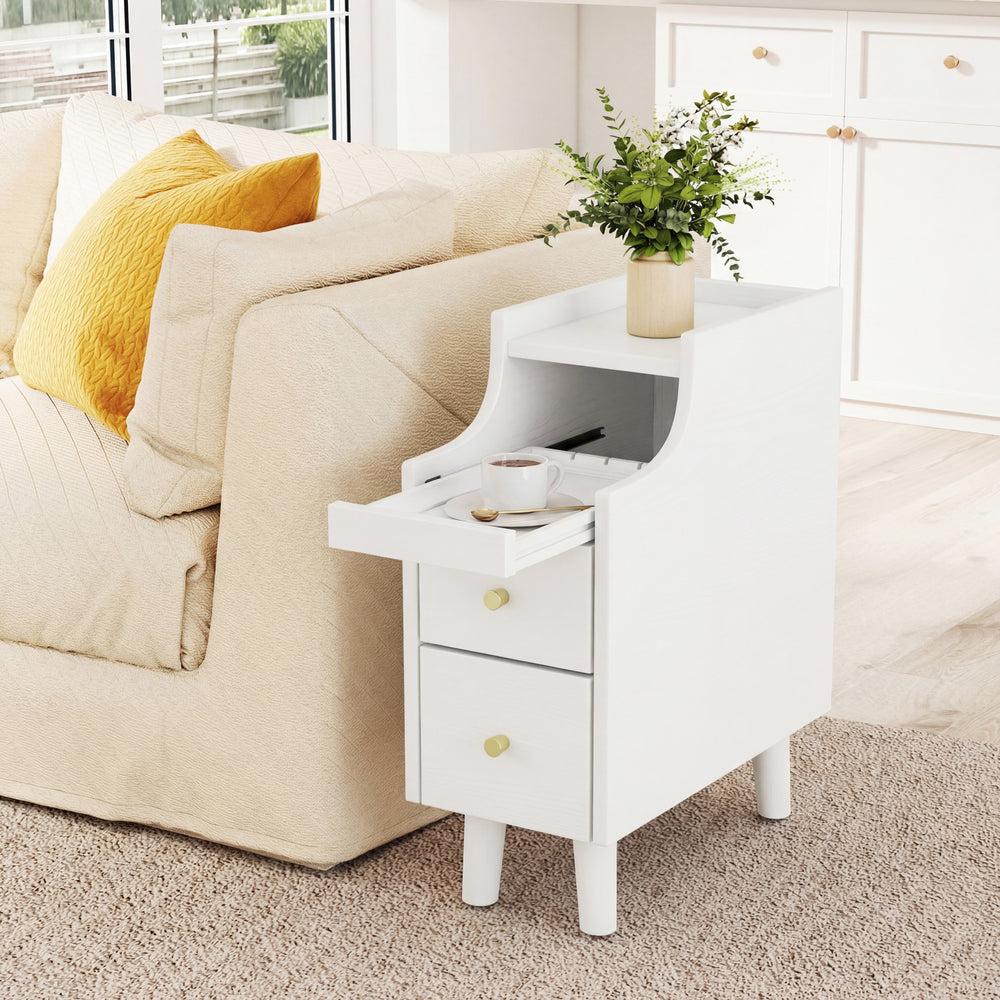Narrow white solid wood nightstand with pull-out tray and two storage drawers, perfect for bedside use.