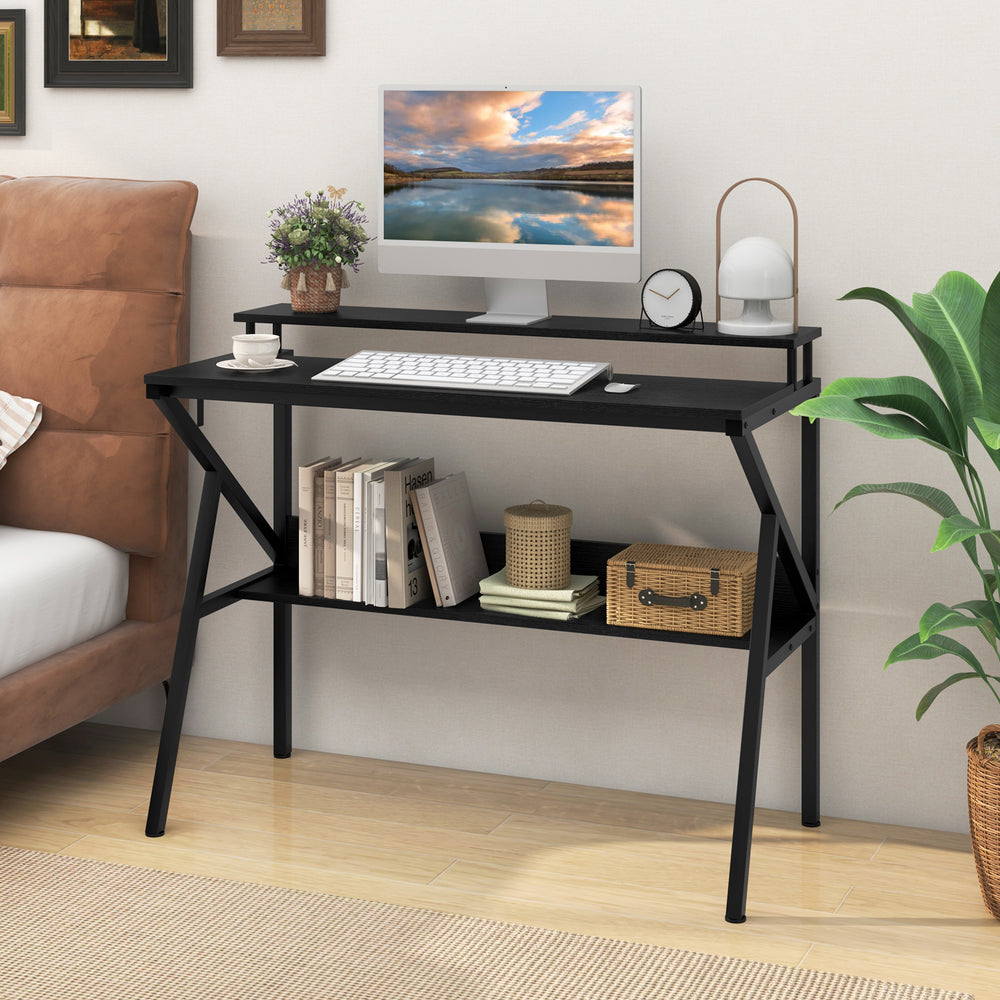Black space-saving computer desk with monitor stand, extra storage shelf, and R-shaped metal frame for stability.