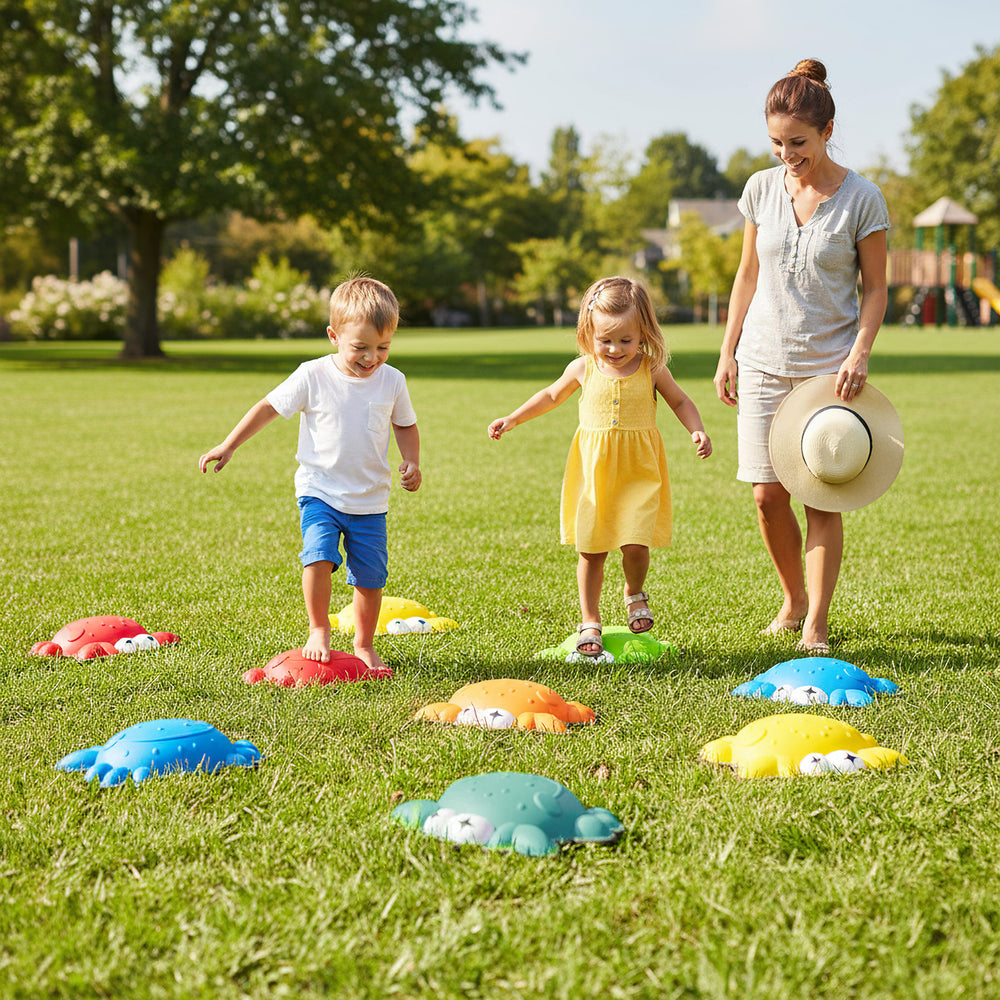Colorful non-slip toddler stepping stones arranged on grass, promoting balance and motor skills during outdoor play.