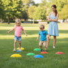 Colorful non-slip toddler stepping stones arranged on grass, promoting balance and motor skills for outdoor play.