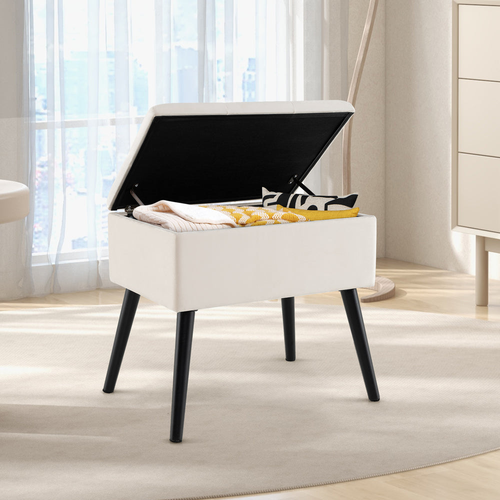 Beige velvet storage ottoman with solid wood legs, featuring an easy-opening lid for versatile living room use.
