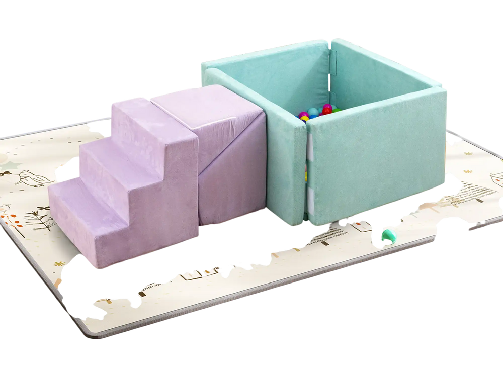 Soft play set featuring purple climbing blocks and a ball pit, ideal for toddlers' imaginative play in a nursery.