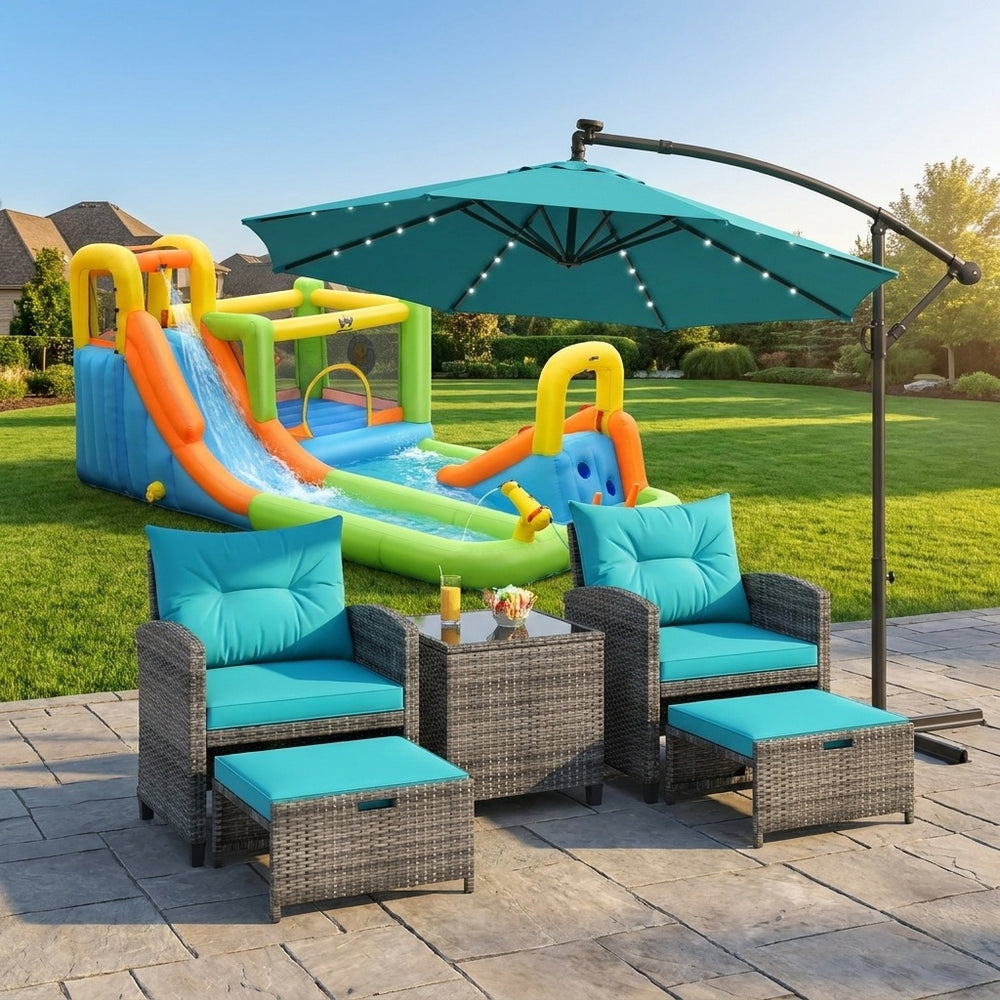 Turquoise patio chairs with cushions and coffee table, featuring a 10ft offset umbrella for outdoor relaxation.