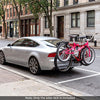 Trunk mount 3-bike rack in pink, designed for SUVs, featuring anti-sway straps and soft padding for stability.