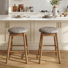 Set of 2 swivel counter height barstools with solid wood legs and PU leather seats, ideal for kitchen islands or home.