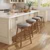 Backless swivel counter height barstools with solid rubber wood legs and PU leather seats, ideal for kitchen islands.