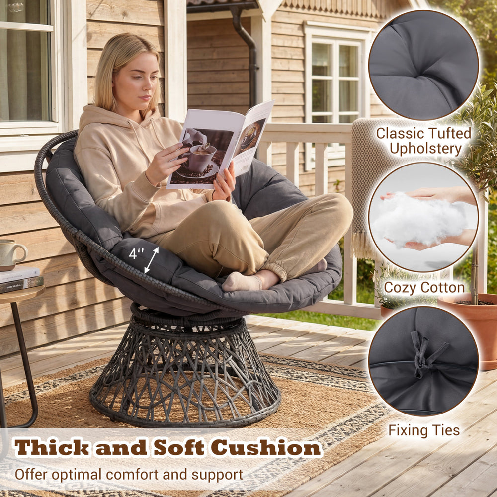 Swivel Papasan chair with thick grey cushion, featuring classic tufted upholstery for comfort and support on patio.