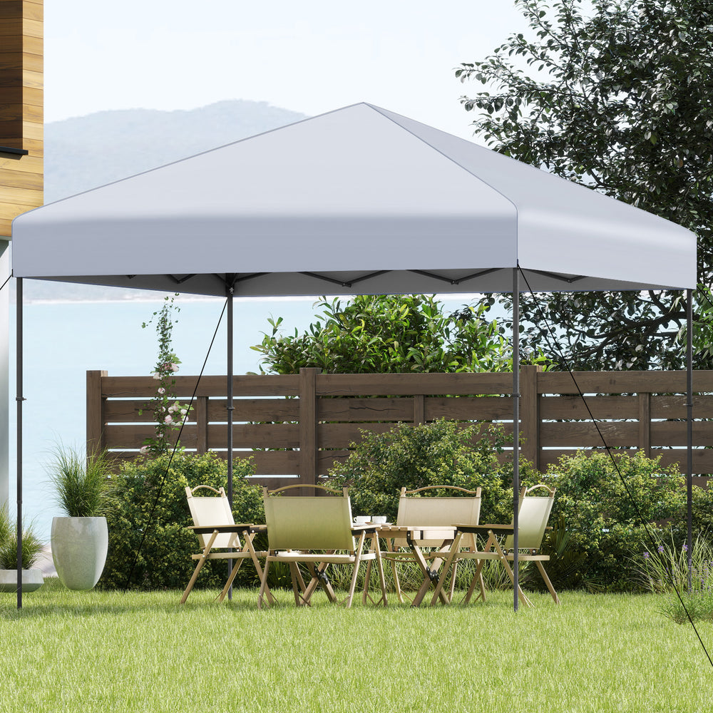 10x10 feet pop-up canopy tent in white, set up in a garden for outdoor events, featuring sturdy truss connections and.