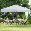 Pop-up 10x10 feet canopy tent in white, set up for outdoor dining with sturdy frame and UPF50+ sun protection.