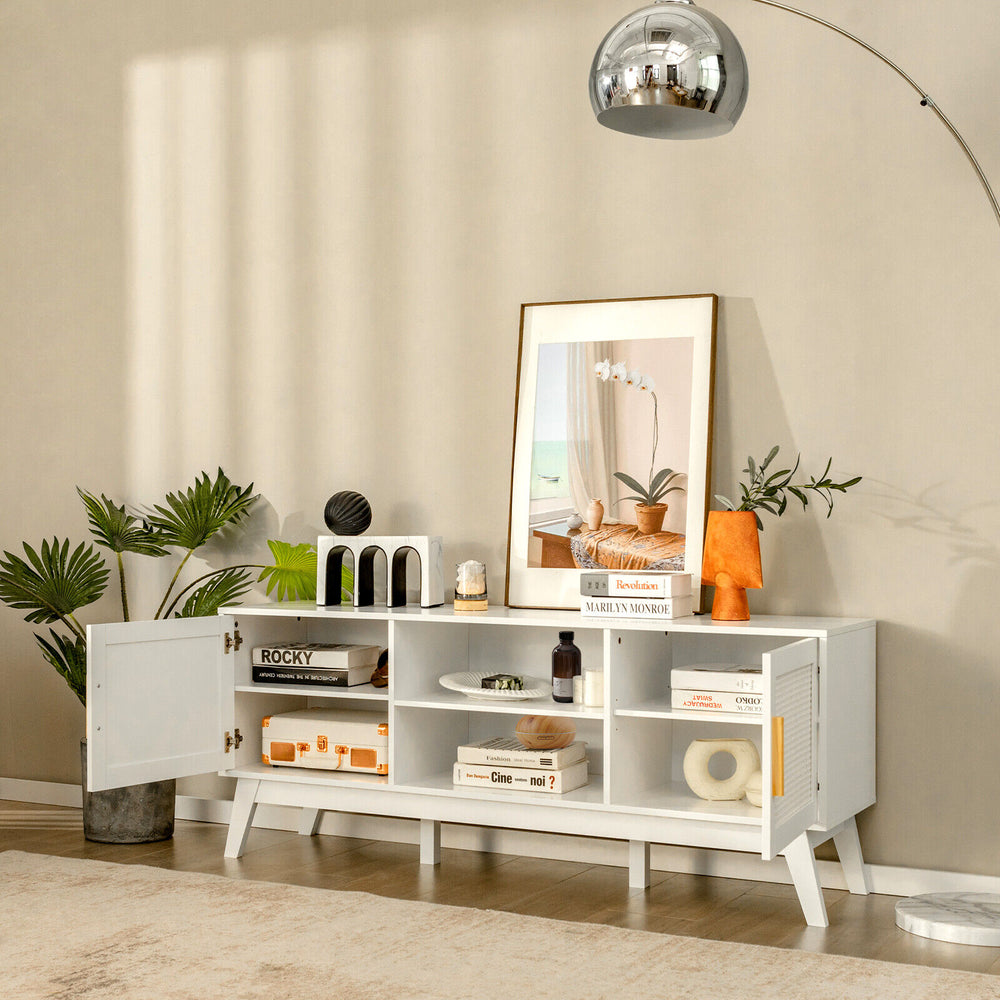 Mid-century modern white TV stand with rattan cabinets and open shelves, ideal for organizing entertainment equipment.