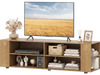 Modern wood TV stand with natural finish, featuring wide tabletop, open compartments, and ample storage for.